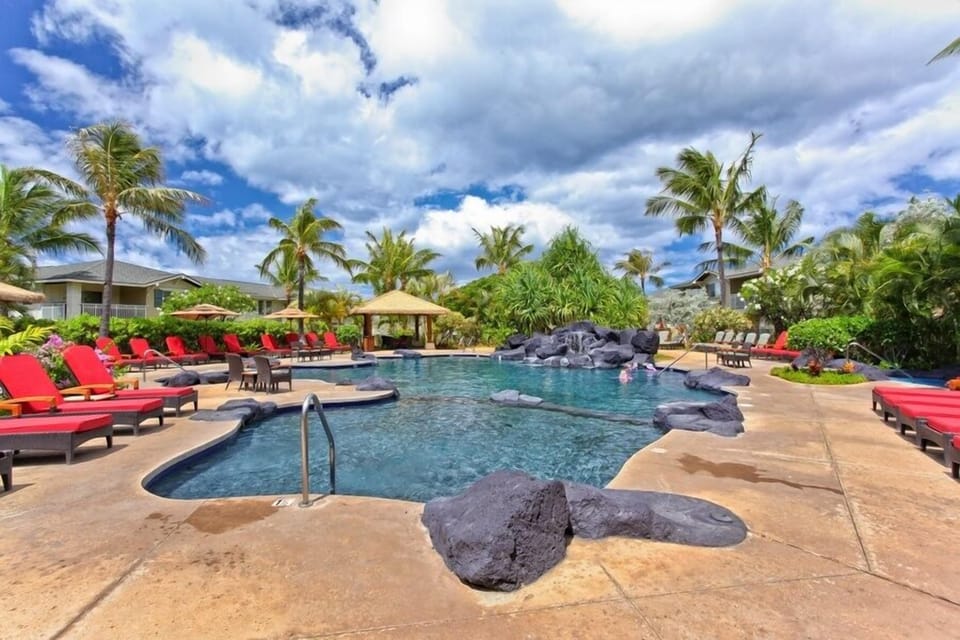 Lounge by the crystal blue waters of the pool.