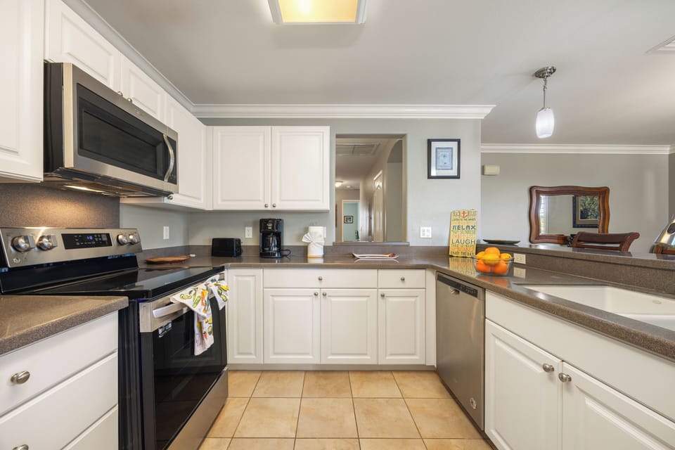 Your fully equipped kitchen awaits with granite countertops, stainless appliances, and everything you need to create delicious meals during your stay.