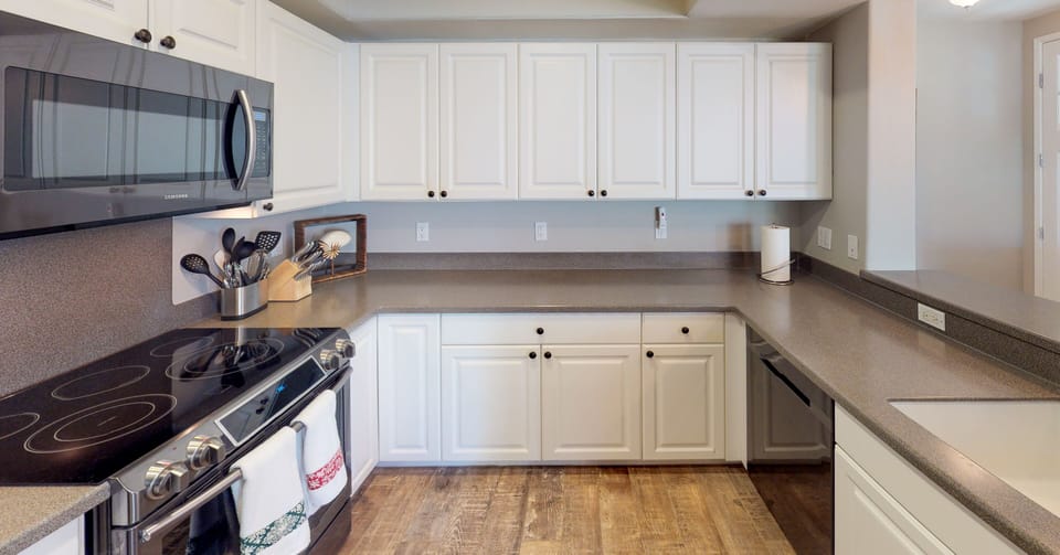 Seamless living for the kitchen, dining and living room in this condo.