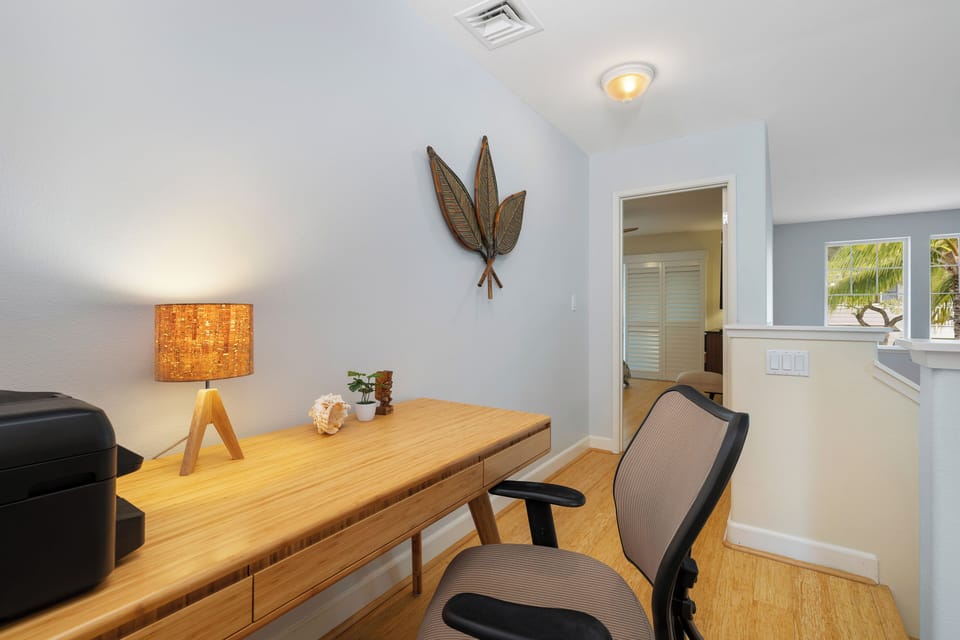 Your productive workspace awaits with natural light streaming through windows and thoughtfully chosen furnishings for comfortable work sessions.