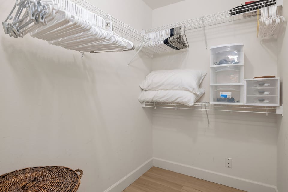 A generous walk-in closet with ample shelving and hanging space lets you unpack and truly settle in during your stay.
