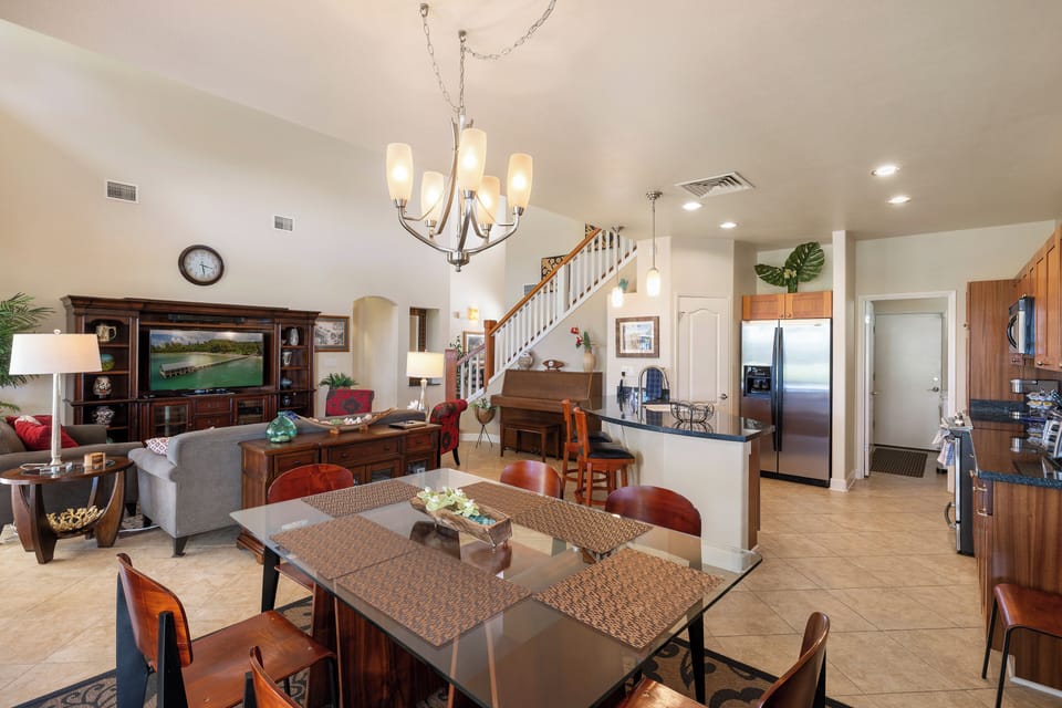 Gather around your spacious dining table while the chef prepares meals in your fully-equipped kitchen, with cozy living areas perfect for relaxing together.