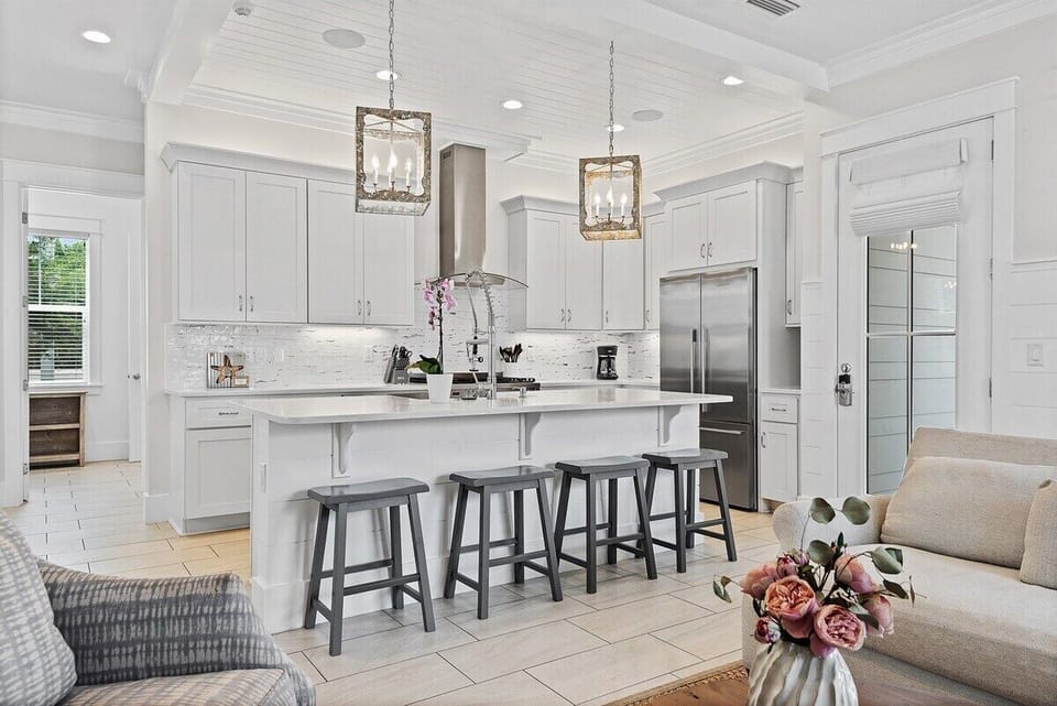Additional bar seating means a place for everybody. Quartz countertops mean easy cleanup!