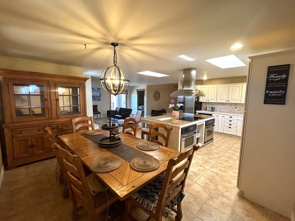 Open concept dining-kitchen-living area.