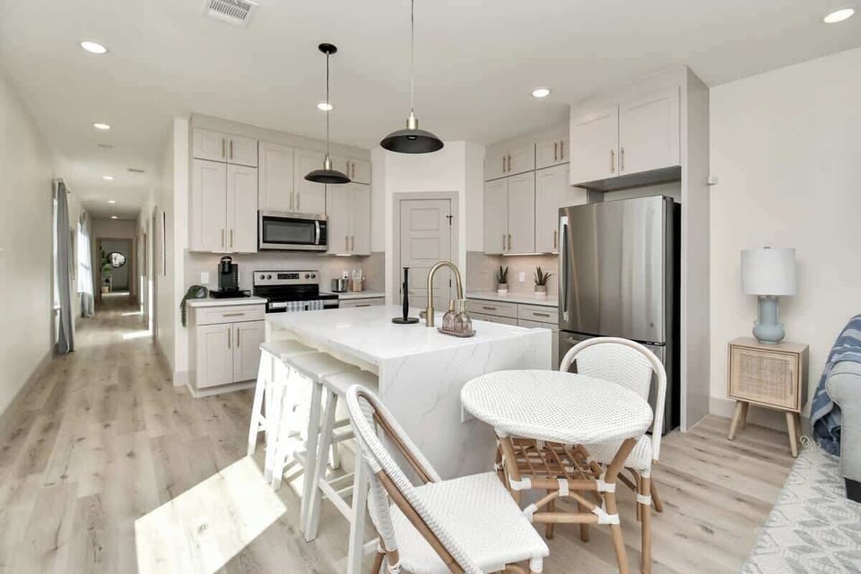 Enjoy a bar stool or the table and chairs in the kitchen seating area. comfortably seats 5.