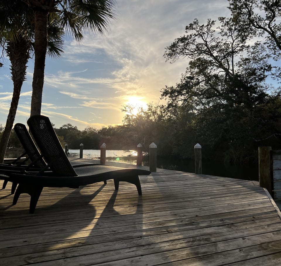 Peaceful views! Uncovered deck space with 2 loungers in front of unit.