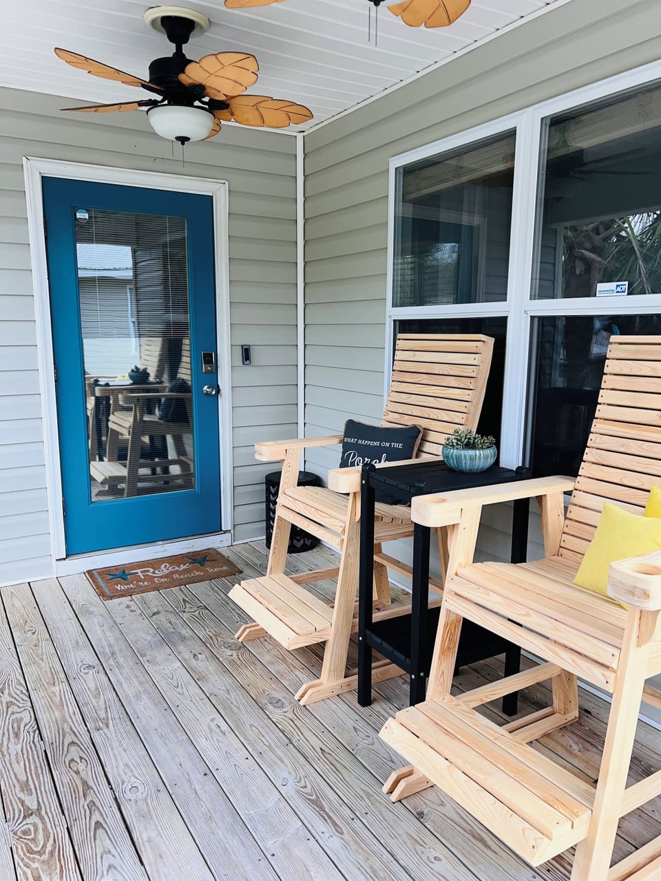 Comfortable chairs and table on balcony for coffee and sunset viewing waterfront
