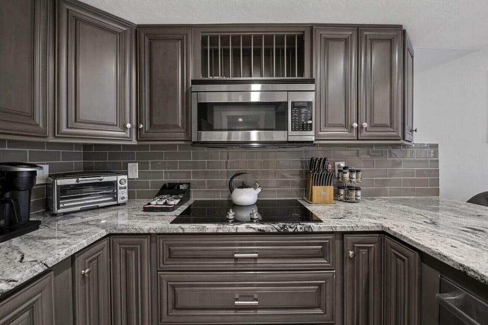Kitchen w/ Microwave and Electric Stove Top