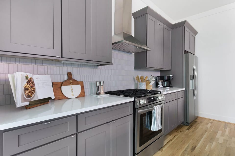 Fully Stocked Kitchen with Modern Appliances and Ample Storage

