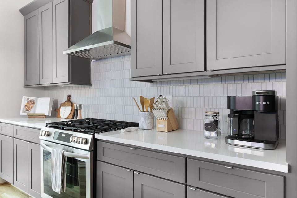 Fully Stocked Kitchen with Modern Appliances and Ample Storage
