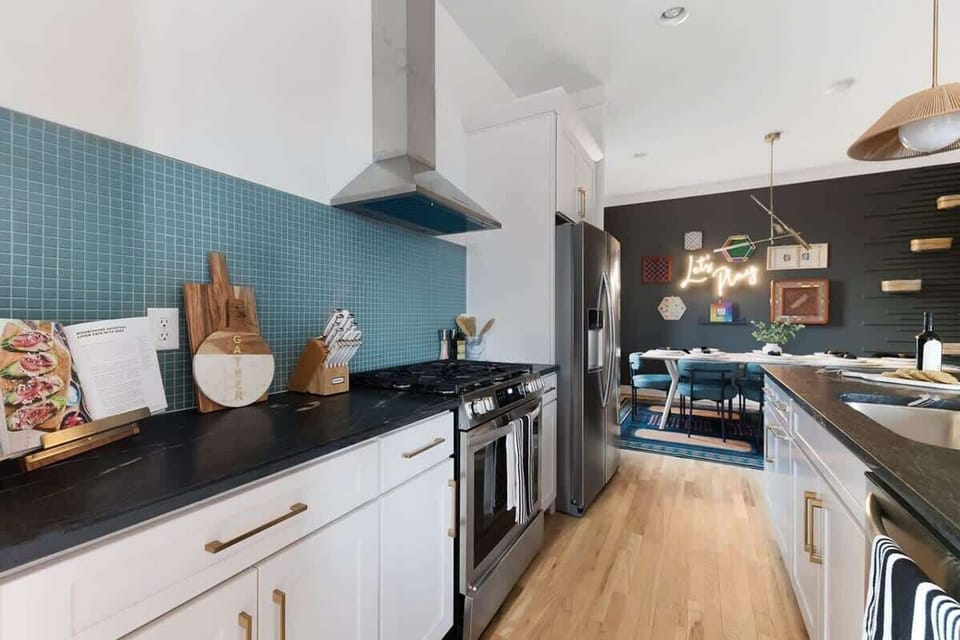 Fully Stocked Kitchen with Modern Appliances and Ample Storage
