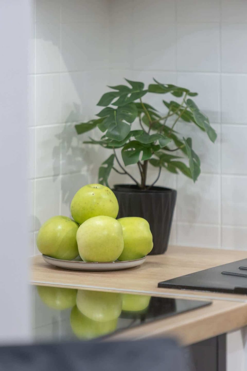 A close-up of a fresh green apple arrangement, adding a natural and refreshing touch to the kitchen or dining space.
