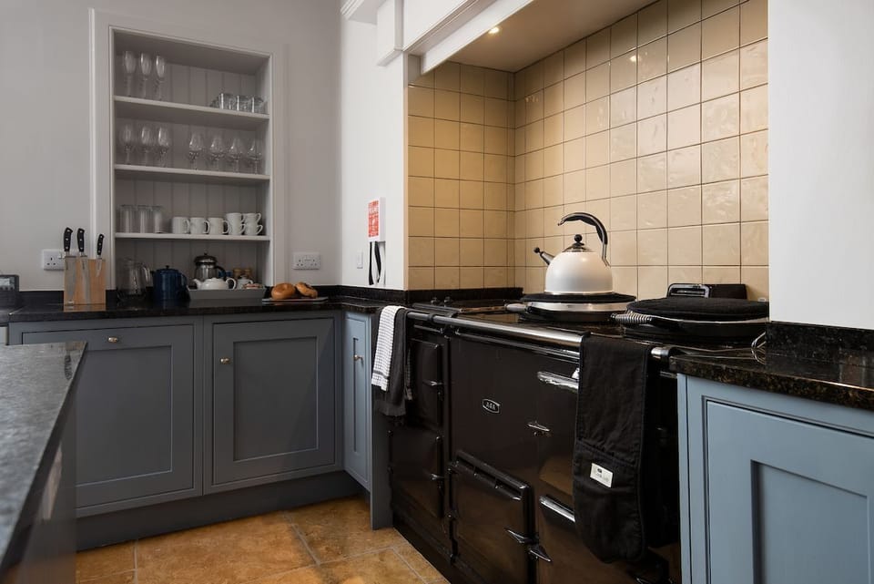 Papple Steading - Papple Farmhouse - kitchen features a five-oven electric Aga with two hotplates and warming plate