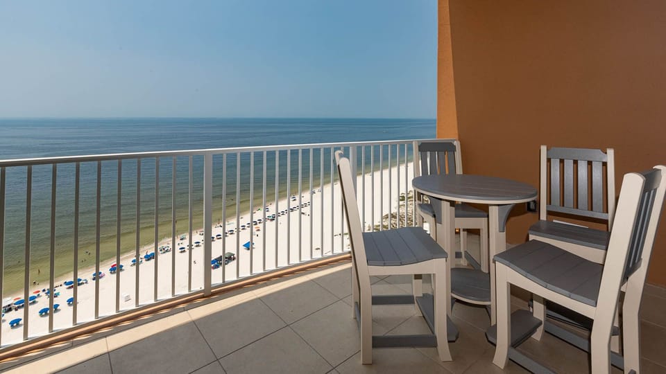 Sit at the round table and listen to the waves while the gulf stretches across the shore