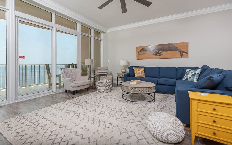 Relax on the cozy sectional and enjoy gulf coast views from the balcony as waves meet the shore