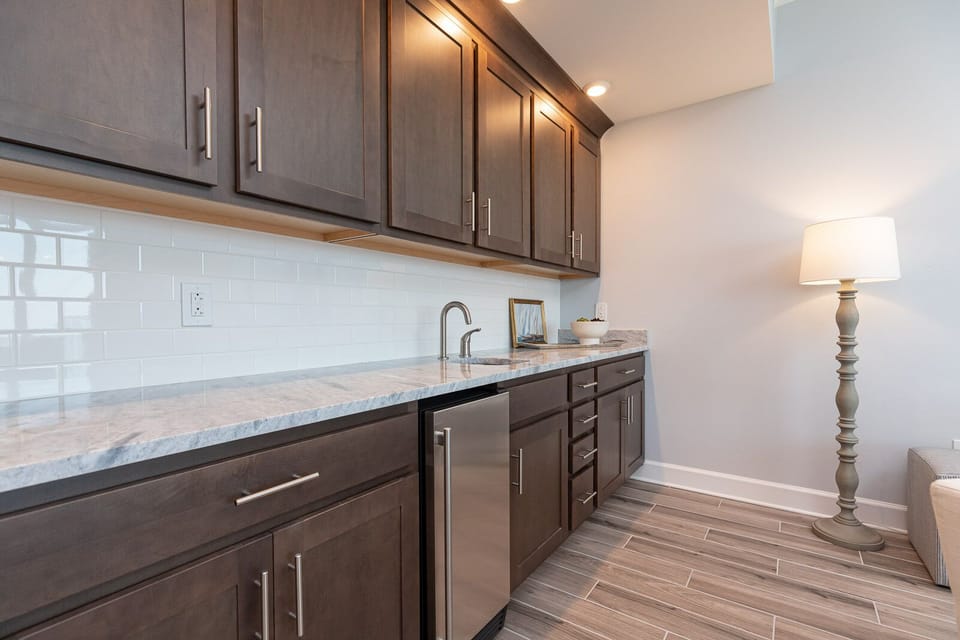 Grab a chilled drink from the built-in mini fridge or pour your favorite drink from the wet bar