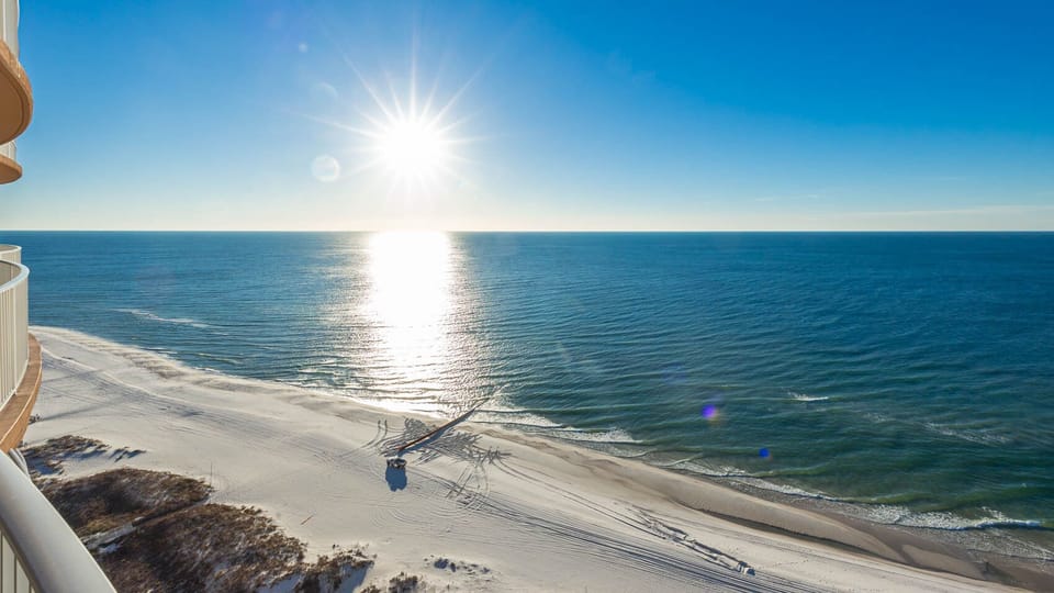 Step onto the balcony and feel the gulf breeze while sunlight sparkles on the shore below