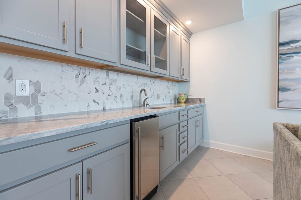 Grab a chilled drink from the fridge or create your favorite cocktail at the wet bar