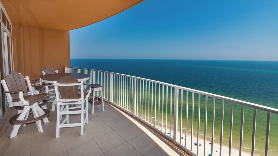 Picture yourself lounging on balcony chairs, feeling gulf breezes and watching the beach below