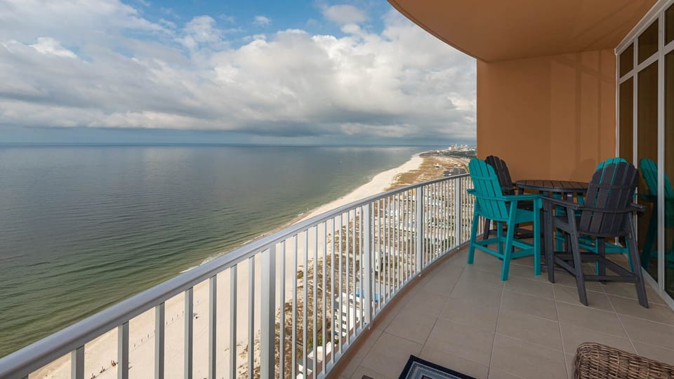 Relax on the balcony chairs, listen to gulf waves, and watch the sweeping beach and distant shoreline