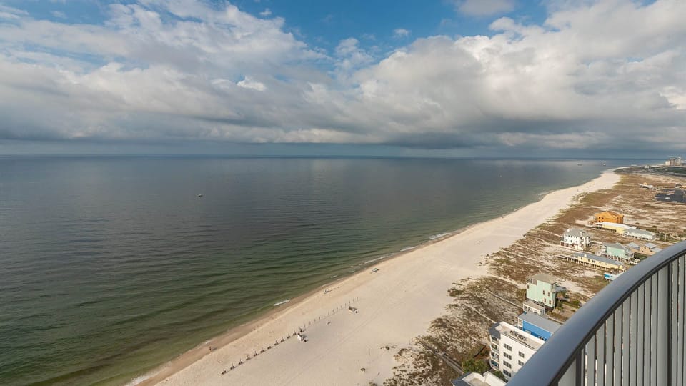 Experience seemingly endless coastline views of the horizon as waves lap the shore and the sun glistens over the water