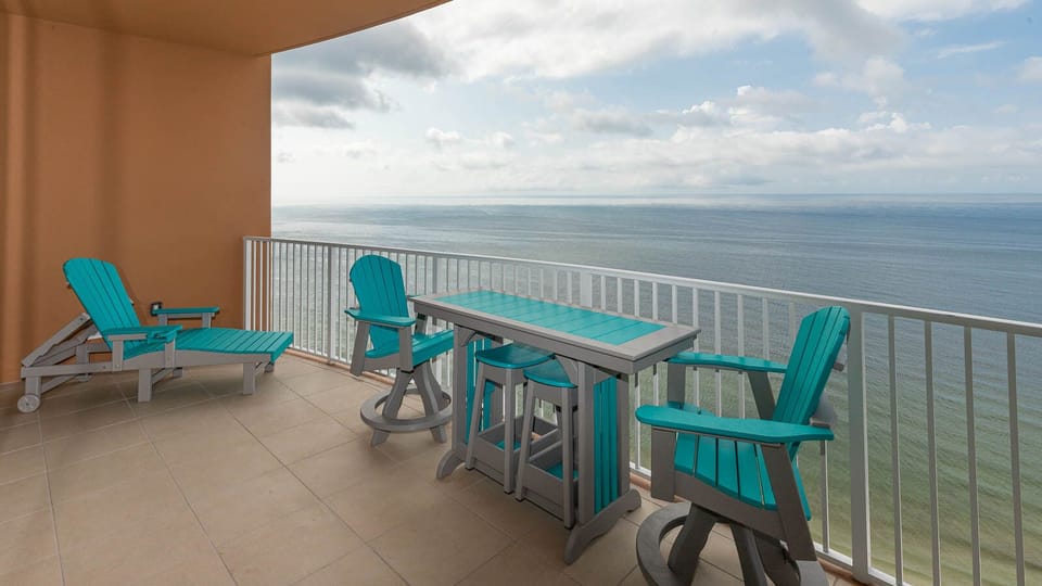 Stretch out on the chaise lounge and gaze across the gulf from the beachfront balcony