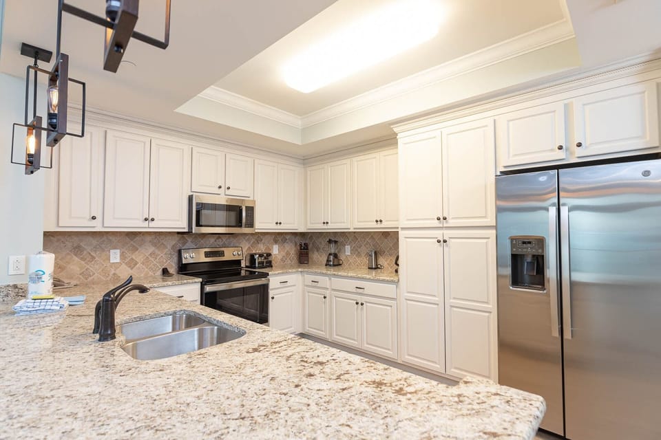 Gather around the kitchen for meals with stainless appliances and spacious counters