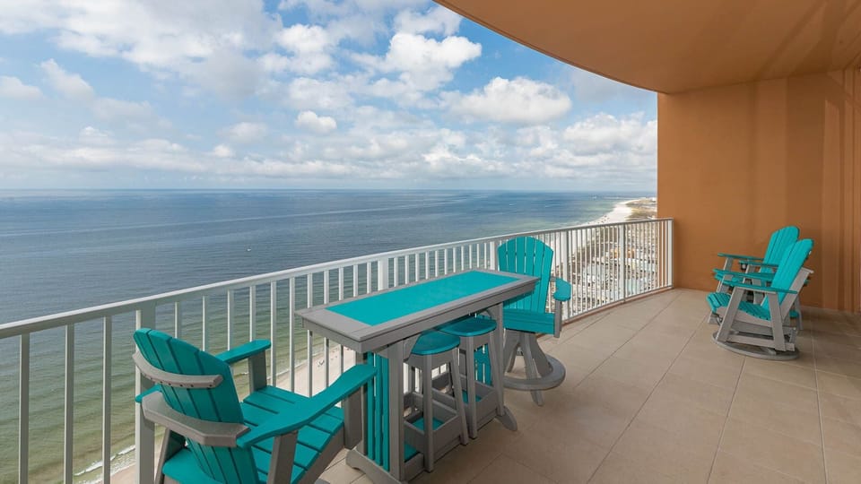 Sit at the turquoise table and listen to waves along the beachfront while watching the gulf horizon