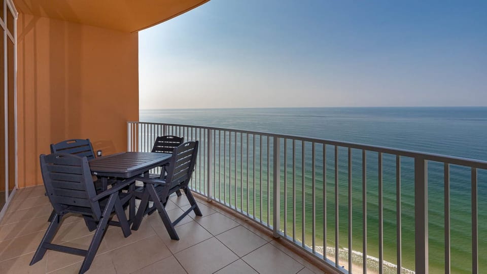 Savor the gulf breeze as waves quietly roll along the shore from your beachfront balcony