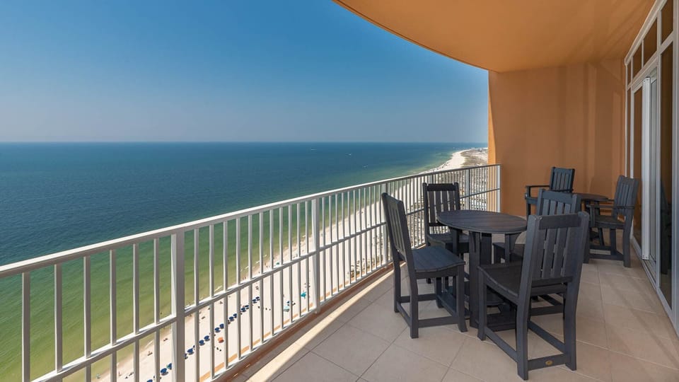 Lounge on the balcony chairs and feel the gulf breeze while watching the beachfront shoreline below