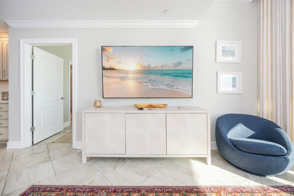 Unwind in this inviting family room and stream shows on the TV while sunlight warms the tile