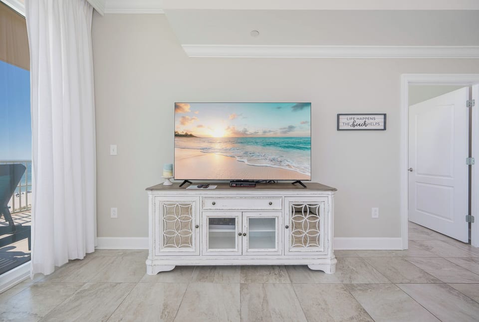 Flip on the large TV for your favorite show, then walk onto the balcony to take in the coastal vibe