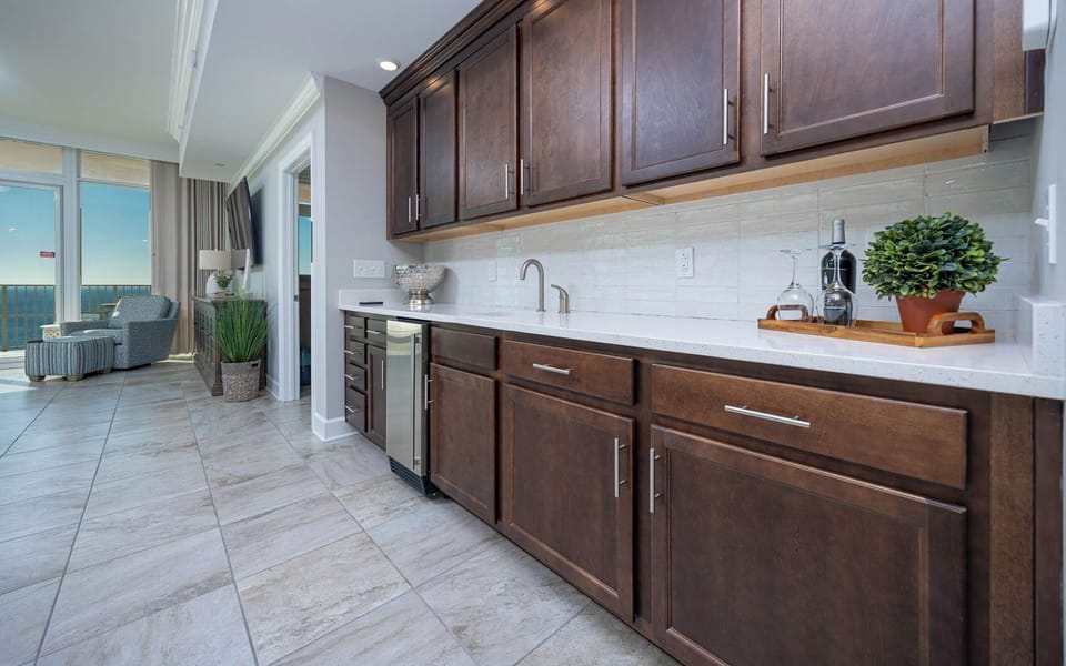 Pour a chilled drink at the wet bar, then step to the railing to feel warm beach breezes