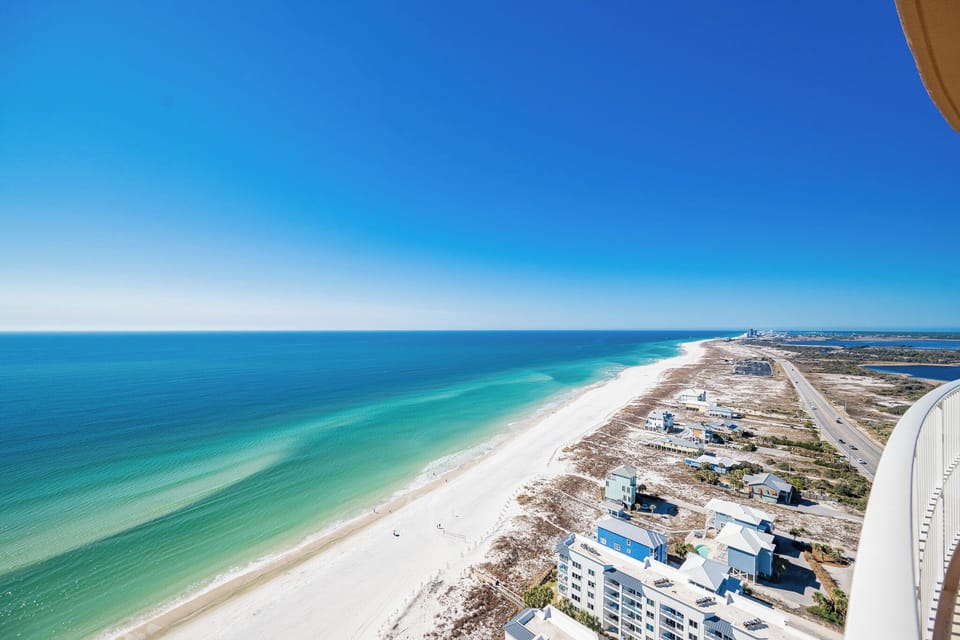 Experience seemingly endless coastline views of the horizon as waves lap the shore and the sun glistens over the water