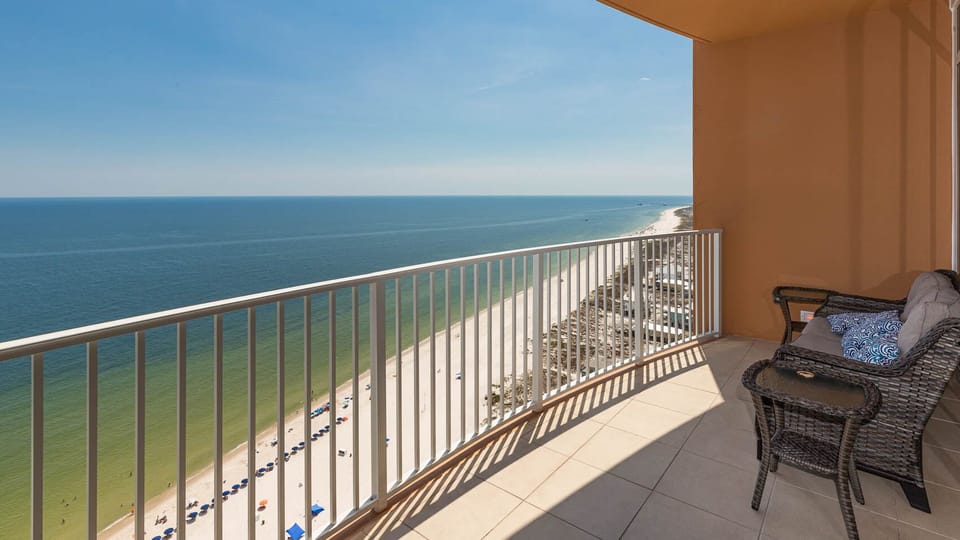 Lounge on the balcony chair, feel the beach breeze, and gaze along the coast from the balcony