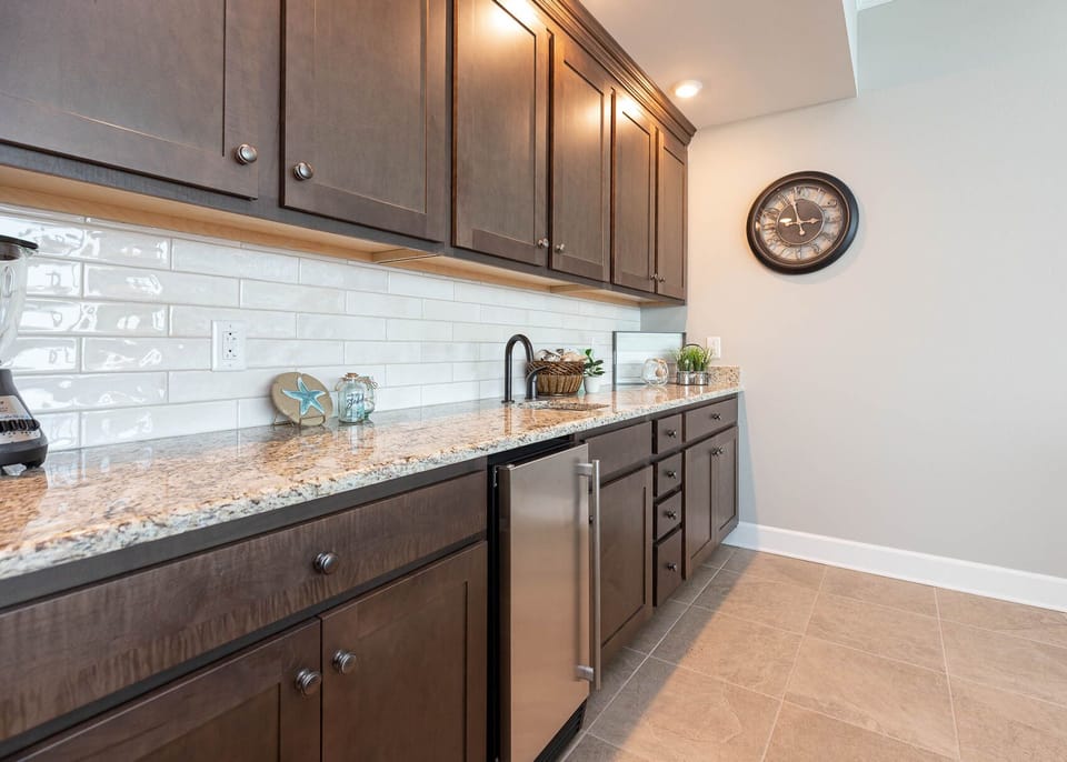 Grab a chilled drink from the fridge or create your favorite cocktail at the wet bar