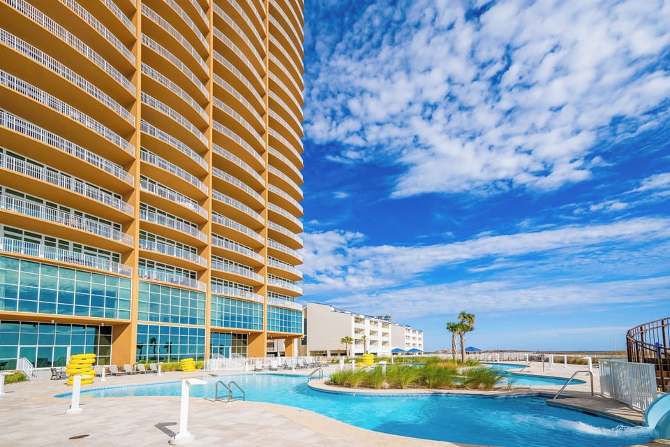 Relax by the pools or lazy rivers with easy access to the beach at Phoenix Gulf Towers in Orange Beach