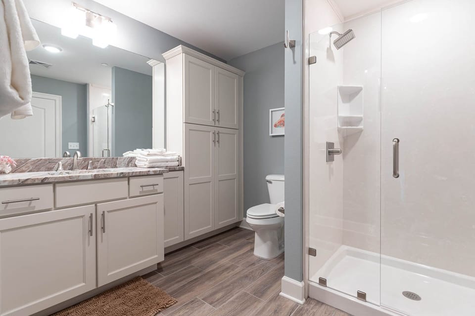 Experience the rain showerhead in this guest bath for a refreshing retreat