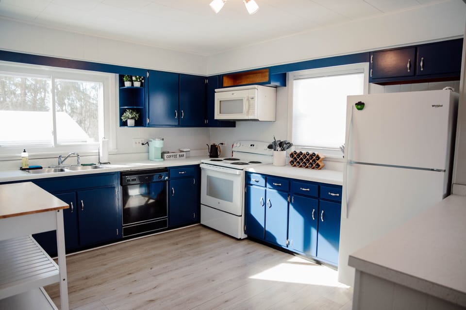 Spacious, fully- stocked kitchen with mobile butcher block island