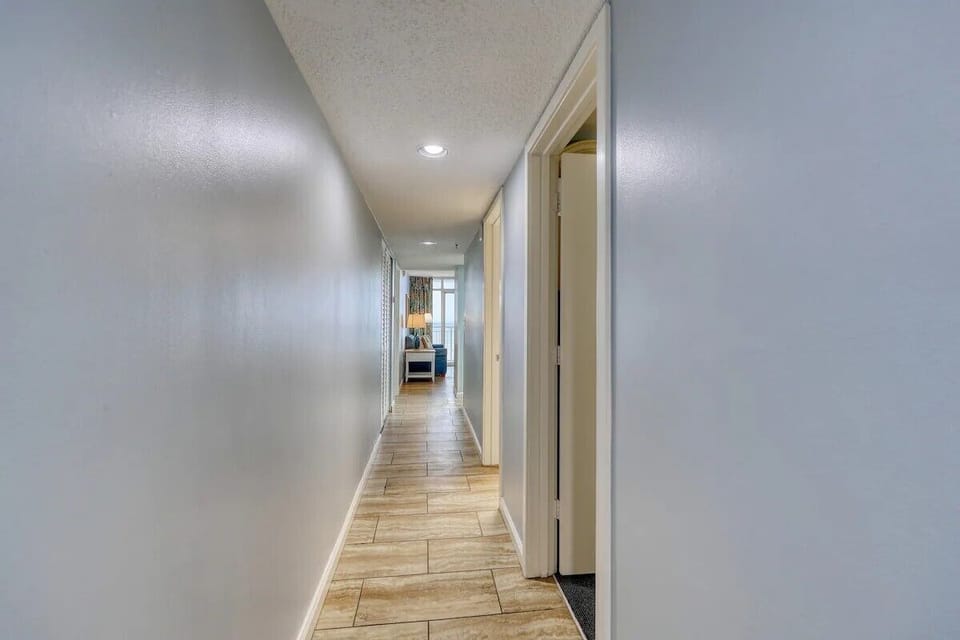 Hallway with warm tones and overhead light