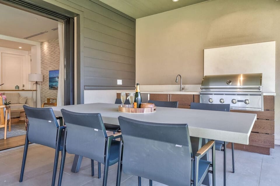 The Lanai offers an outdoor kitchen with a Coyote Grill, sink and under counter fridge.
