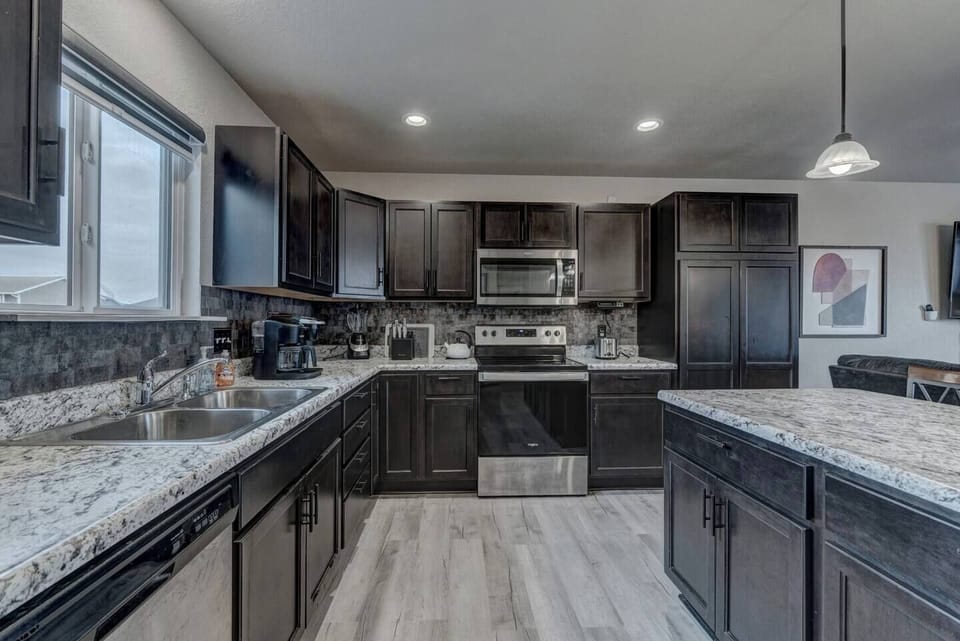 Stainless steel microwave, electric range and oven.