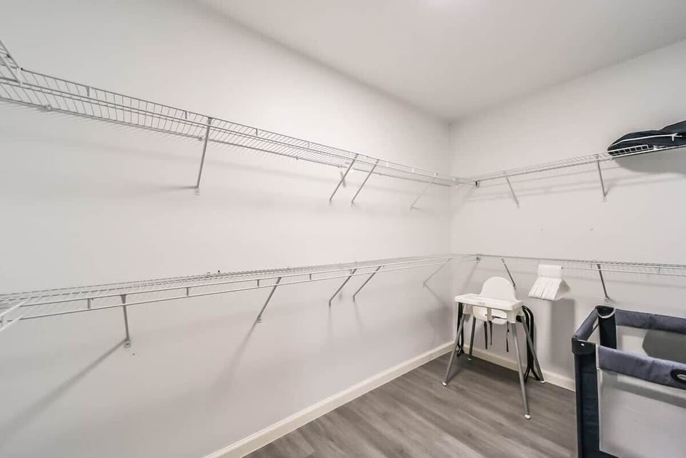 Closet with crib and baby chair