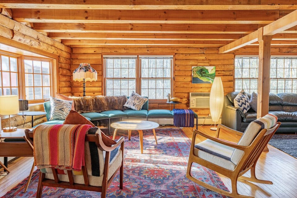 This sofa and chairs are parallel to the indoor wood stove