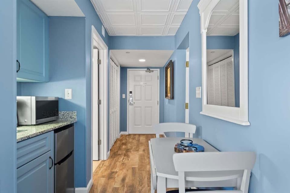 - Cozy dining nook with seating for two near kitchenette   - Ideal spot for morning coffee or quick beachside meals   - Convenient setup adds charm to Myrtle Beach condo stay