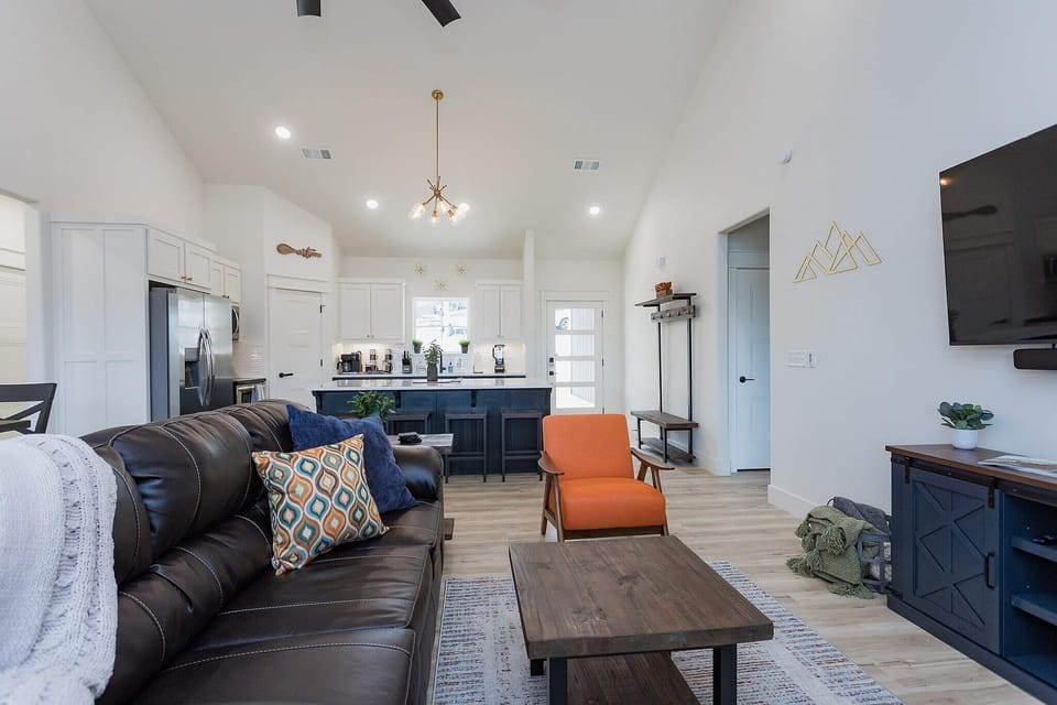 Open concept living to kitchen.
