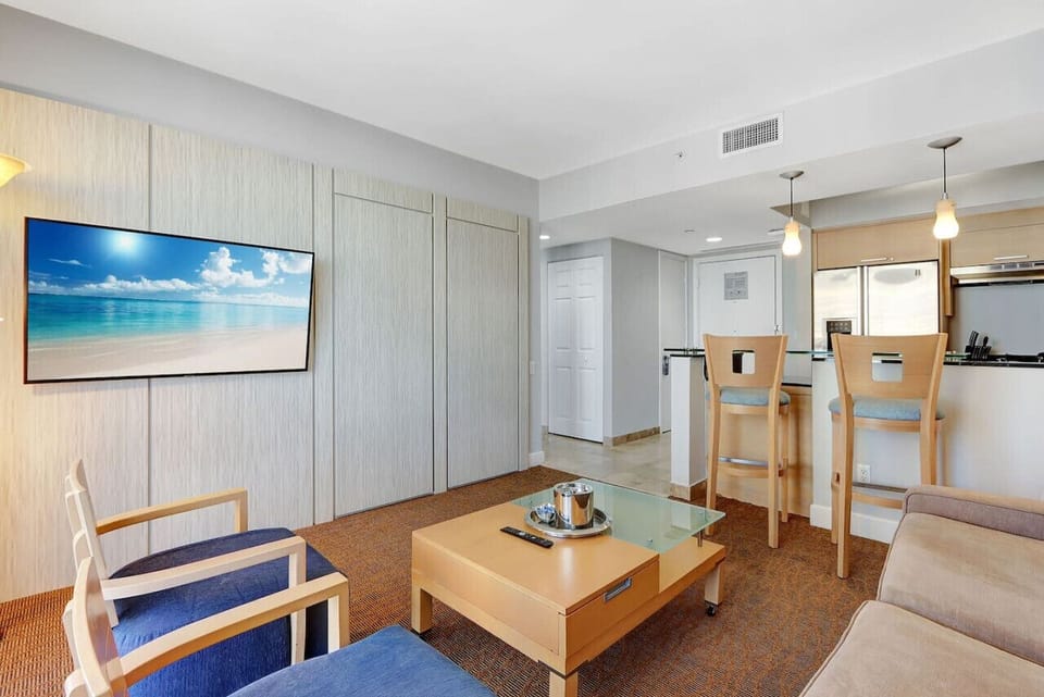 Pristine living room with a Smart TV and a Sofa that can turn into a Queen size bed