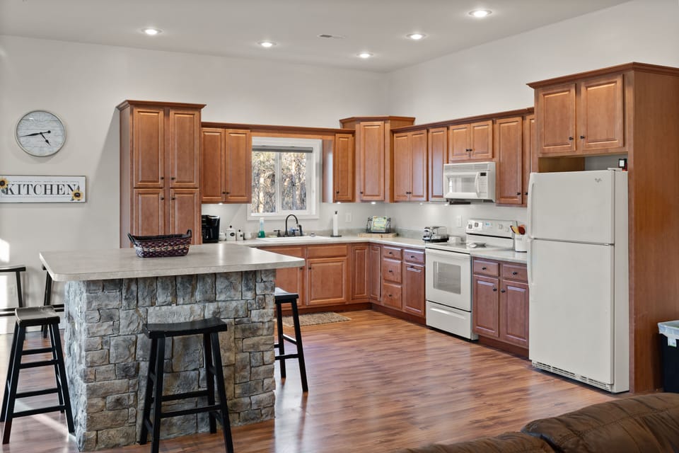 Well-equipped kitchen with ample cabinetry and modern appliances, ready for any culinary challenge.