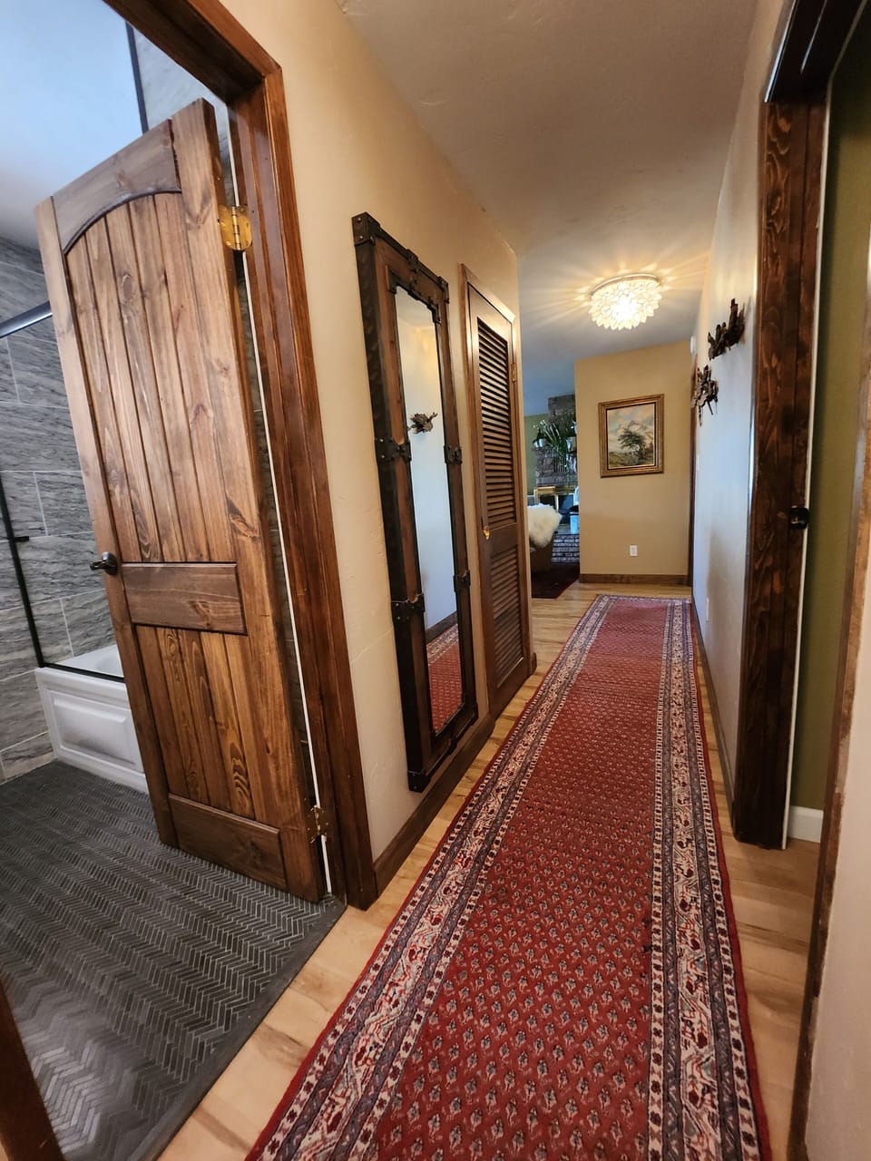 Hallway from front door and Kitchen.  Guest bath/Guest Bed, Master, living room
