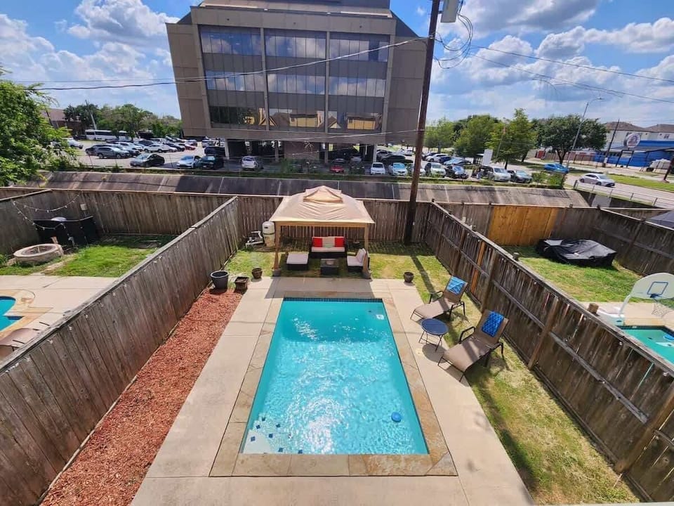 Inviting private pool with sunny seating and relaxing backyard vibes.